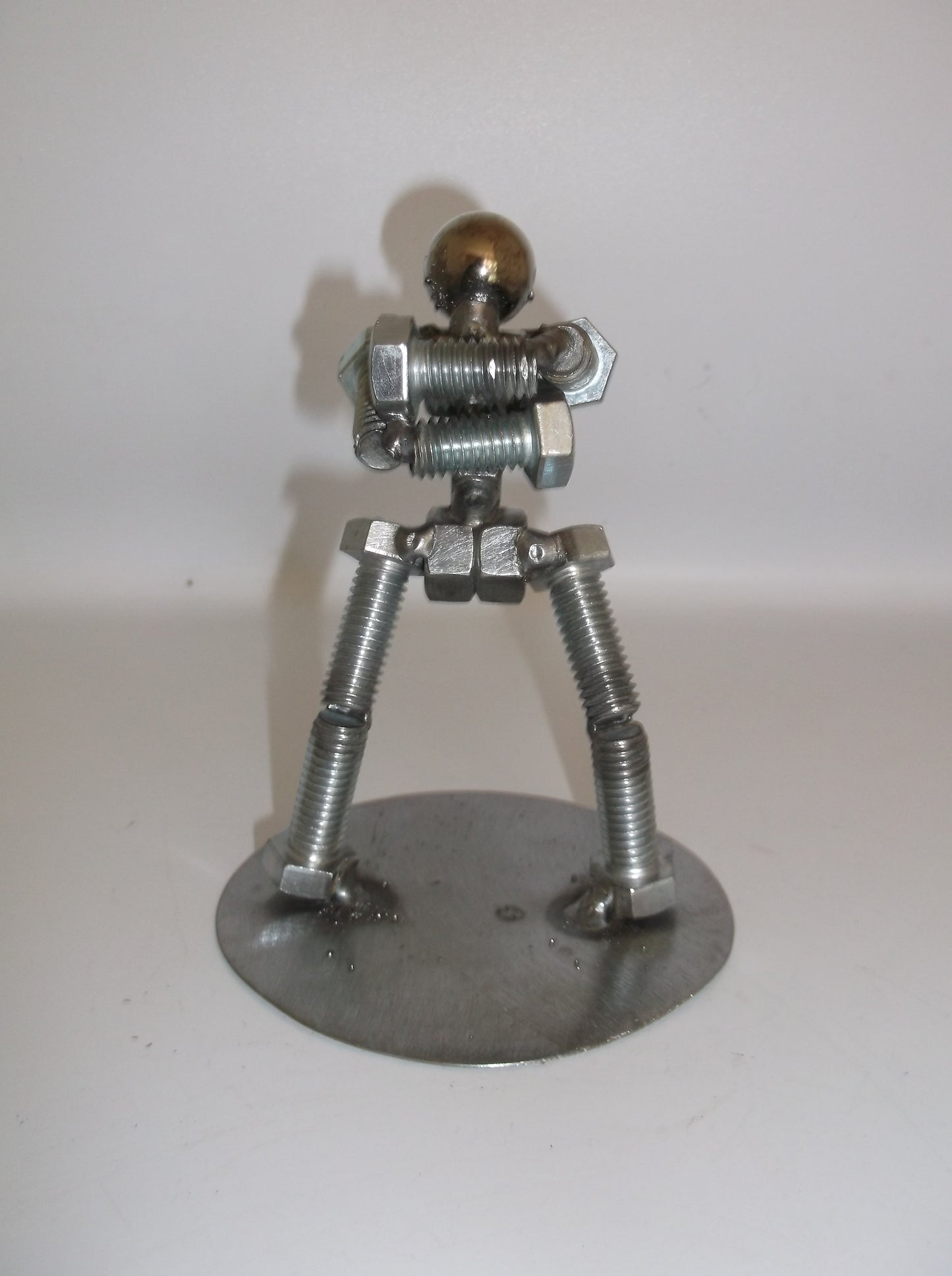 Standing with arms folded, Metal Bolt Figurine