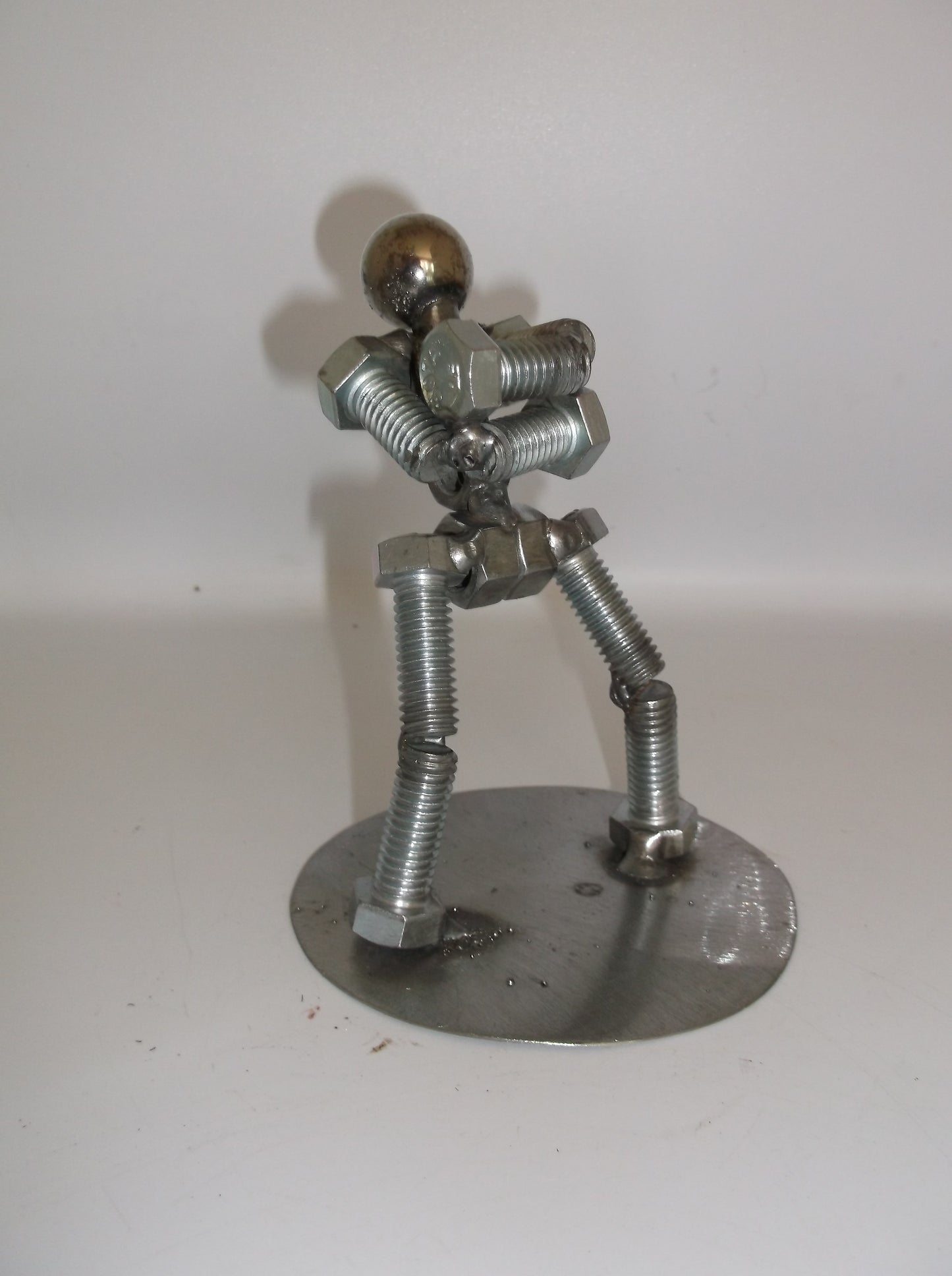 Standing with arms folded, Metal Bolt Figurine
