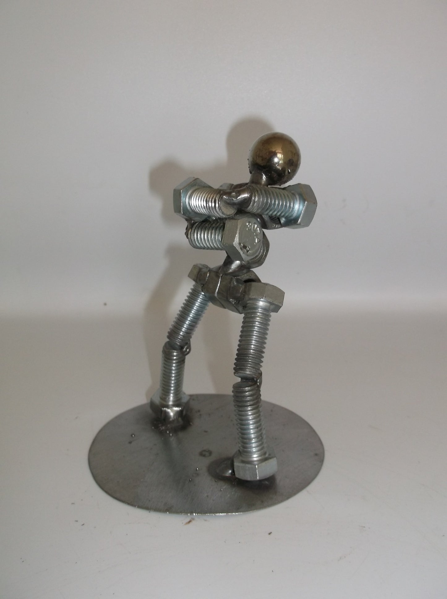 Standing with arms folded, Metal Bolt Figurine