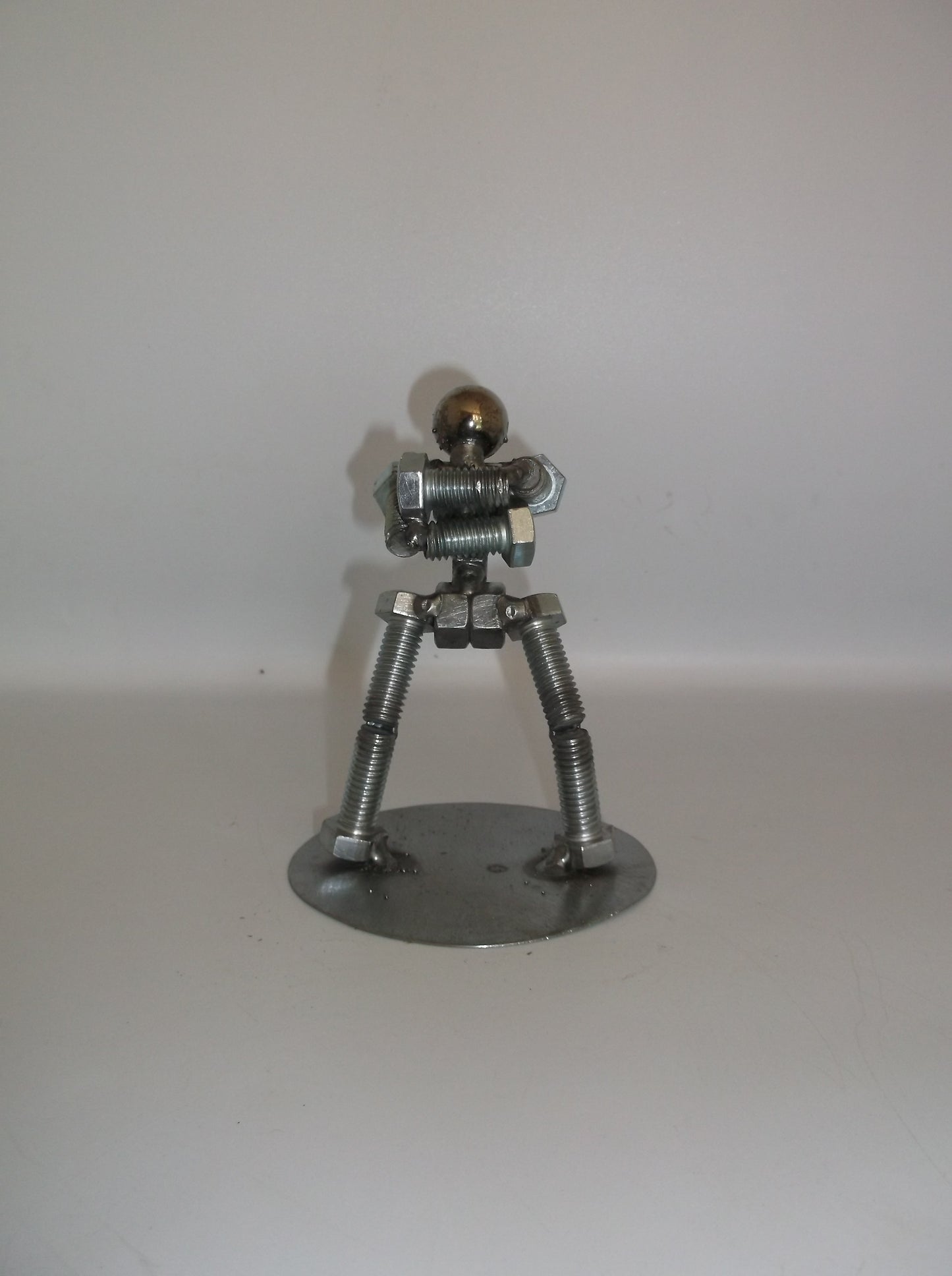 Standing with arms folded, Metal Bolt Figurine