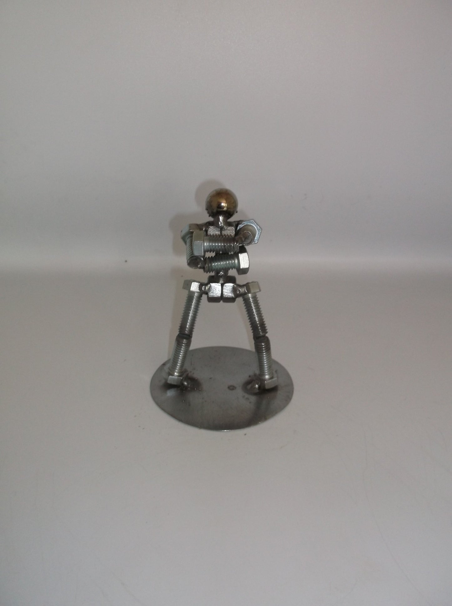 Standing with arms folded, Metal Bolt Figurine