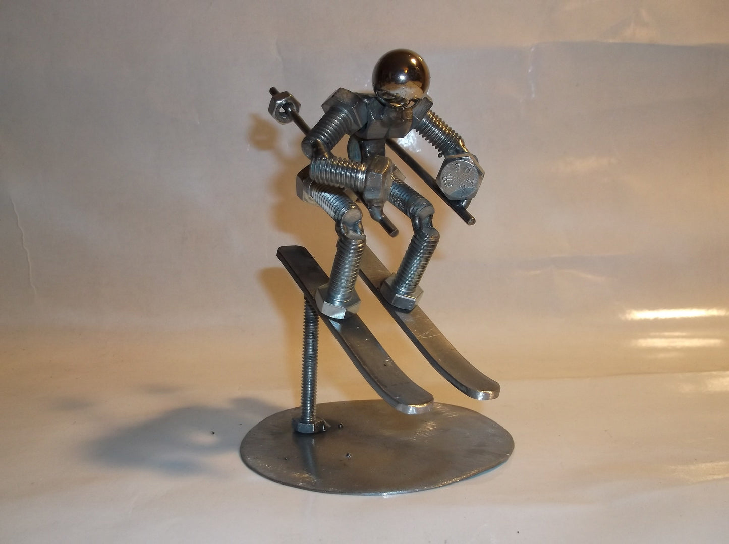 Skier Metal Bolt Figurine